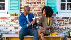 A couple toast coffee cups
