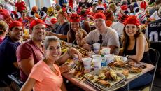 Diners wear crab hats at the Annapolis Crab Feast in Annapolis, Maryland, USA.