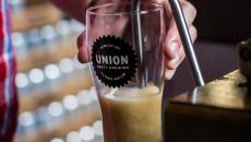 A stout being poured Union Craft Brewing in Baltimore, Maryland, USA