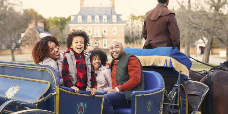A family riding in a carriage