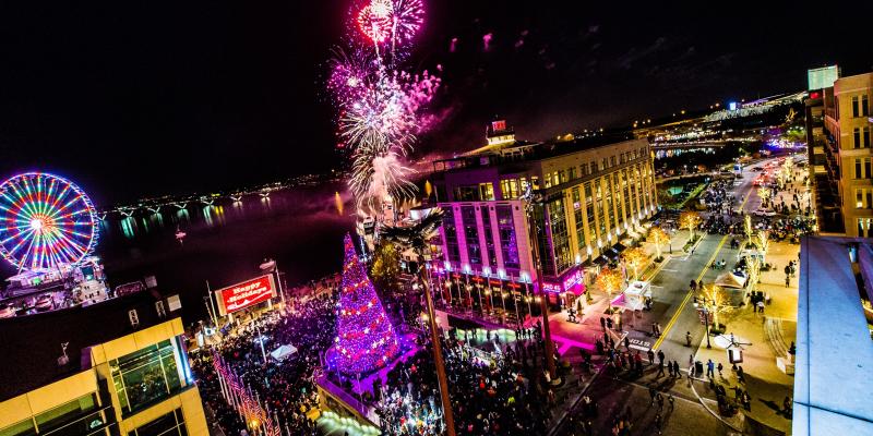 Aerial nightime view of the tree lighting and fireworks celebration