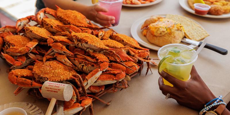 Traditional Maryland Crab Feast A table set with a platter of seasoned blue crab