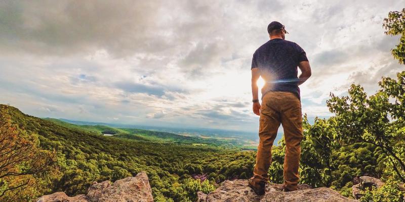 A person stands on an overlook and admires the view in Maryland, USA