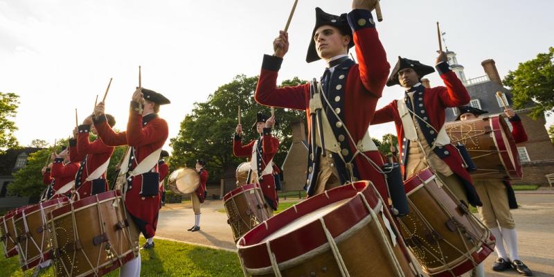 Fifers and drummers in colonial costume perform in front of the Governor's Palace in Williamsburg, Virginia, USA