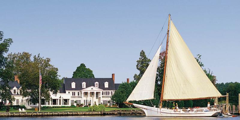 A skipjack sail boat outside of the Inn at Perry Cabin in St. Michaels, Maryland, USA