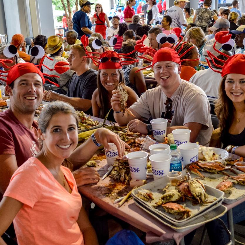 Diners wear crab hats at the Annapolis Crab Feast in Annapolis, Maryland, USA.