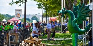 A vendor with a dragon sculpture on the National Mall