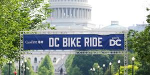 Riders crossing the starting line in front of the US Capitol Bulding