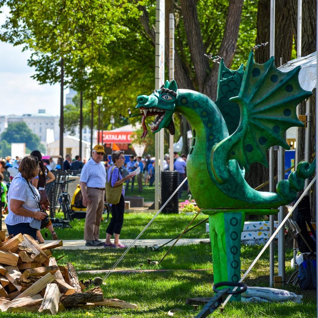 A vendor with a dragon sculpture on the National Mall