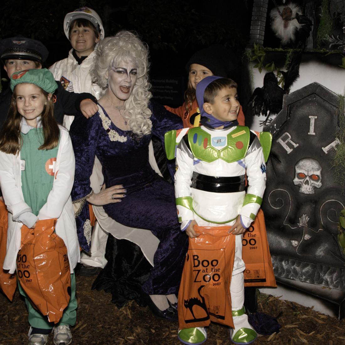 Halloween character and costumed children