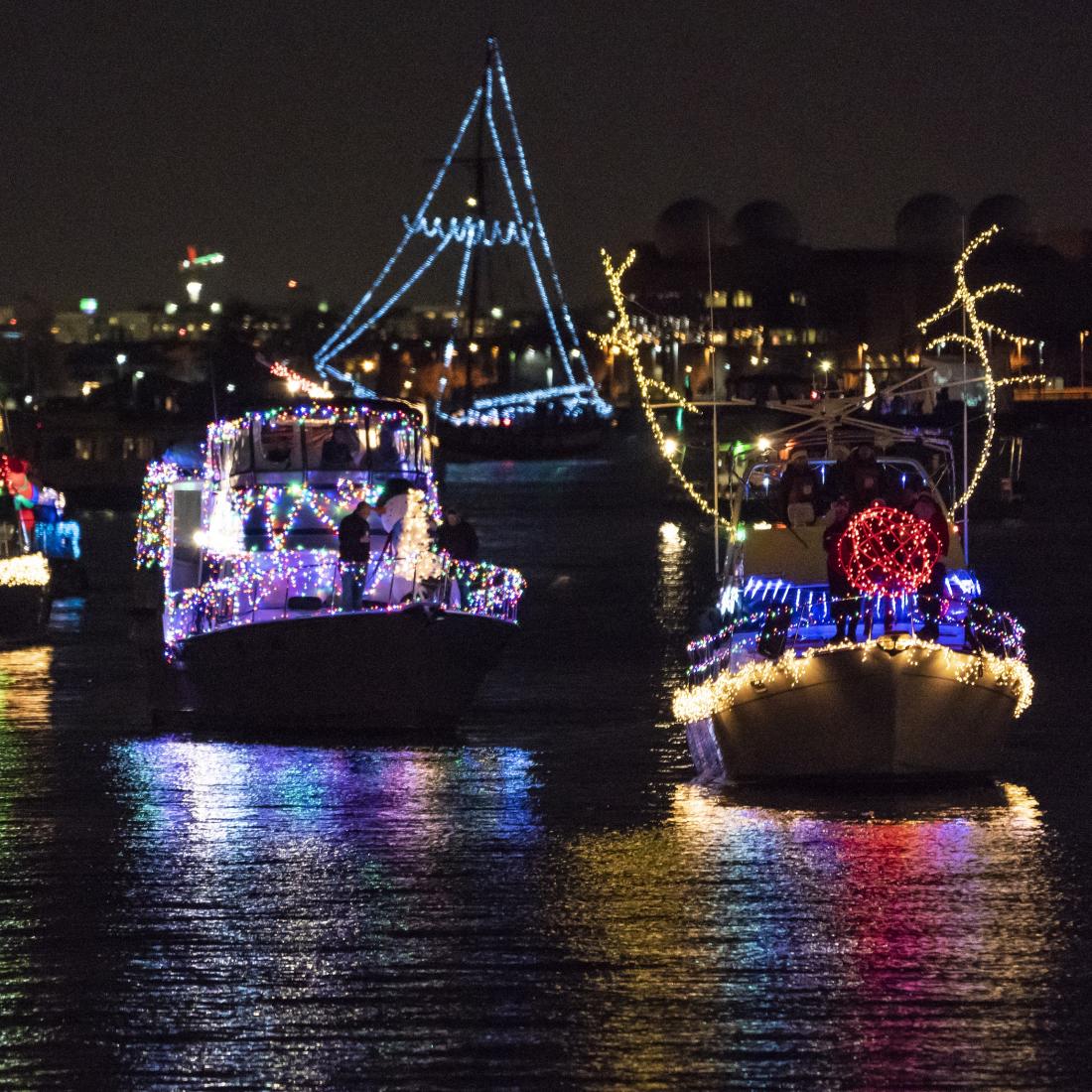 Decorated boats sailing at night