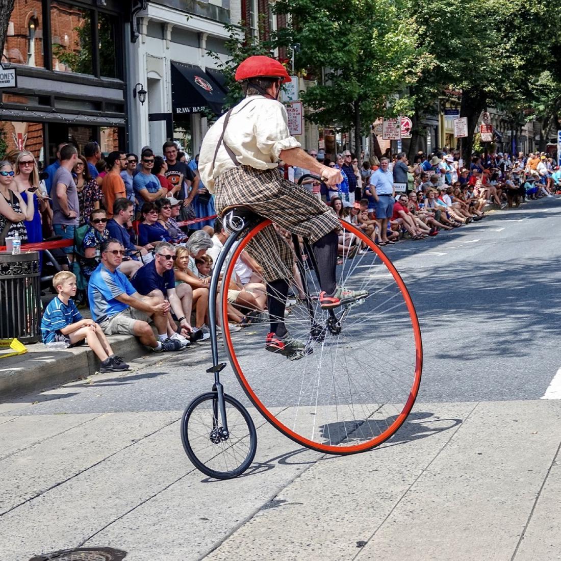A racer on the crowd lined streets