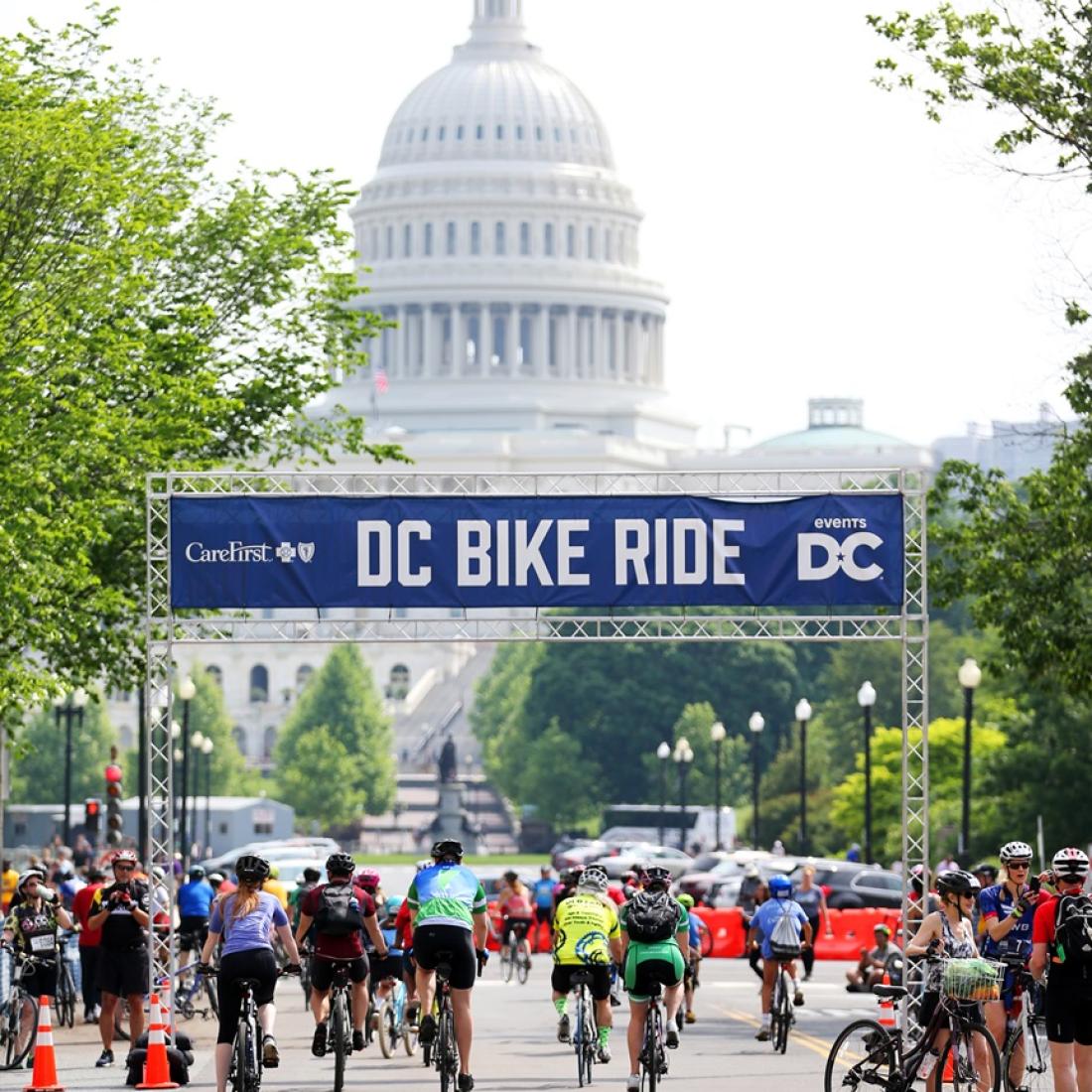 Riders crossing the starting line in front of the US Capitol Bulding